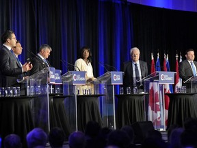 Conservative leadership hopefuls, from left, Pierre Poilievre, Patrick Brown, Scott Aitchison, Leslyn Lewis, Jean Charest and Roman Baber take part in the Conservative Party of Canada French-language leadership debate in Laval, Quebec on May 25, 2022.