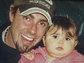 Family photo of Kirk Holifield with his infant daughter.