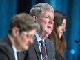 Michael MacDonald, centre, flanked by fellow commissioners Leanne Fitch, left, and Kim Stanton, delivers remarks at the Mass Casualty Commission inquiry into the mass murders in rural Nova Scotia on April 18 - 19, 2020, in Halifax on Monday, March 28, 2022.