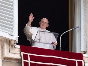Pope Francis waves from a window during the Regina Caeli prayer, in Saint Peter's Square at the Vatican May 8, 2022.