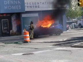 A screenshot from a video of a Tesla burning to the ground in Vancouver, B.C. in May 2022. Photo by Sons of Distillery Vancouver /YouTube