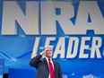 Donald Trump takes the stage to address the National Rifle Association's annual conference at the Lucas Oil Stadium in Indianapolis, April 26, 2019.