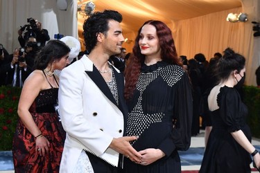 US musician-actor Joe Jonas and wife English actress Sophie Turner arrive for the 2022 Met Gala at the Metropolitan Museum of Art on May 2, 2022, in New York. - The Gala raises money for the Metropolitan Museum of Art's Costume Institute. The Gala's 2022 theme is "In America: An Anthology of Fashion".