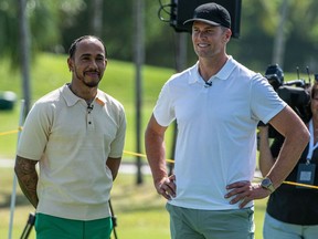 Mercedes' British driver Lewis Hamilton (left) and NFL quarterback Tom Brady attend the Big Pilot Charity Challenge at the Miami Beach Golf Club, in Miami Beach, Florida on May 4, 2022.