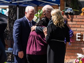 U.S. President Joe Biden embraces Mandy Gutierrez, the Priciple of Robb Elementary School, as he and First Lady Jill Biden pay their respects in Uvalde, Texas on May 29, 2022.