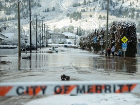 Flood waters cover a neighbourhood a day after severe rain prompted the evacuation of the city of 7,000 in Merritt, on Nov, 16, 2021.