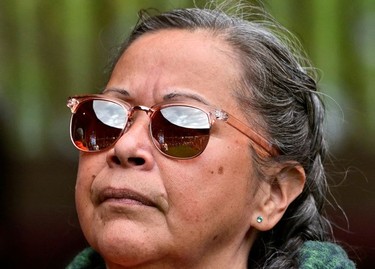 The Tk'emlups Pow Wow Arbour is reflected in Jackie Jules sunglasses, during a ceremony marking the first anniversary of the discovery of unmarked Indigenous child graves in Kamloops, B.C., May 23, 2022.