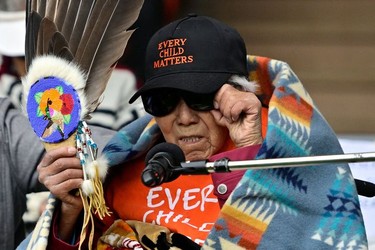 Elder Mona Jules, a residential school survivor, speaks during a memorial event to mark the one-year anniversary of the discovery of unmarked Indigenous children's graves at the Tk'emlups Pow Wow Arbour in Kamloops, B.C., May 23, 2022.