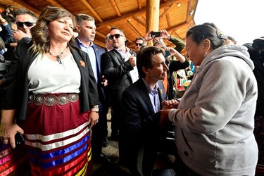 Canada's Prime Minister Justin Trudeau greets Tk'emlups te Secwepemc community members with K?kpi7 (Chief) Rosanne Casimir at a memorial event marking the first anniversary of the discovery of unmarked Indigenous child graves at the Tk'emlups Pow Wow Arbour in Kamloops, B.C., May 23, 2022.