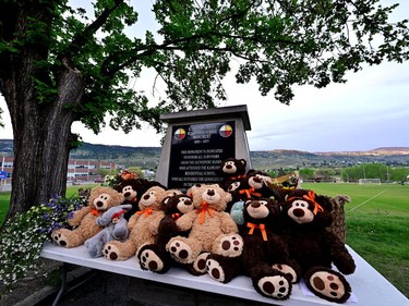 Teddy bears are displayed outside of The Kamloops Residential School, on the day the Tk'emlups te Secwepemc community holds a memorial event marking the first anniversary of the announcement of the discovery of unmarked Indigenous child graves at the Tk'emlups Pow Wow Arbour in Kamloops, B.C., May 23, 2022.