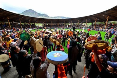 Tk'emlups te Secwepemc community members drum at a memorial event marking the first anniversary of the discovery of unmarked Indigenous child graves at the Tk'emlups Pow Wow Arbour in Kamloops, B.C., May 23, 2022.