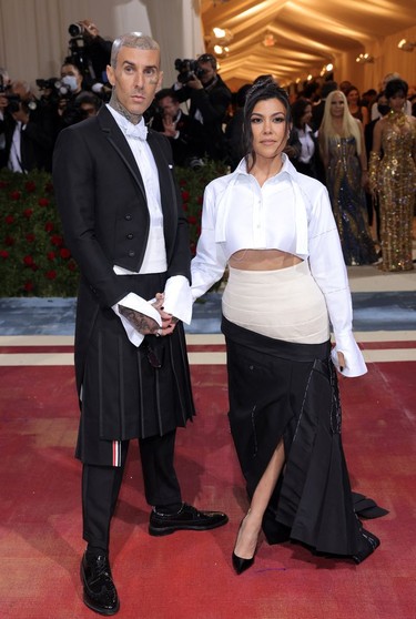 Kourtney Kardashian and Travis Barker arrive at the In America: An Anthology of Fashion themed Met Gala at the Metropolitan Museum of Art in New York City, New York, U.S., May 2, 2022.