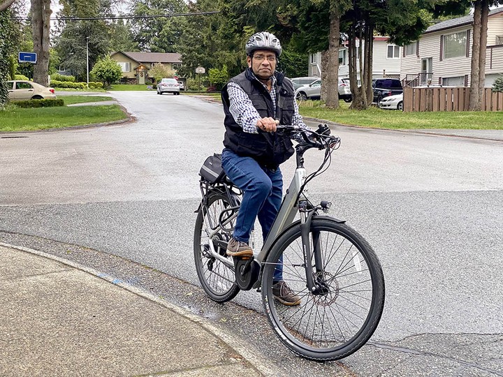  Surrey’s Atul Porwal uses his e-bike to go everywhere, including his offices in Langley.