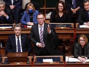 Liberal House Leader Todd Stone (left) and former Opposition Liberal Leader Shirley Bond, (right) look on as new Opposition B.C. Liberal Leader Kevin Falcon gives a speech the legislative assembly at legislature in Victoria, Monday, May 16, 2022.