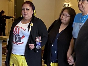 Martha Martin (in white shirt) arrives with family members for the coroner's inquest into the fatal shooting death of her daughter Chantel Moore, in Fredericton, Monday, May 16, 2022. Moore, 26, was shot by Edmundston, N.B. police while conducting a wellness check on June 4, 2020.