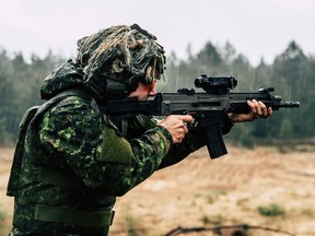 FILE PHOTO: Canadian Armed Forces soldiers with enhanced Forward Presence Battle Group – Latvia conduct foreign weapons cross training during Operation REASSURANCE at Camp Adazi, Latvia on May 18, 2021.