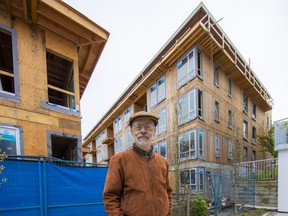 Since they produce less carbon emissions than concrete highrises, Paul Morris would like to see more six-storeys wooden buildings in more Vancouver neighbourhoods, including along the Broadway corridor. The longtime sustainability specialist stands in front of four-storey apartments under construction on King Edward.