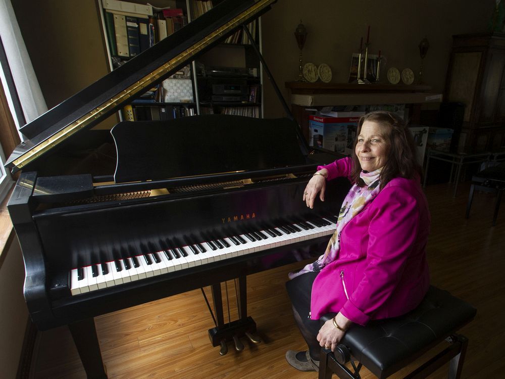 Cynthia Loveman at her 1971 Yamaha C3 conservatory piano in her Vancouver home on the day she got it back after disappearing years ago while in storage.