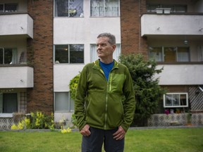 Mike Hanafin is a longtime renter in Mount Pleasant, who worries about the possibility of being displaced by a wave of redevelopment related to the Broadway plan. Hanafin is pictured in front of three-story rental apartments in his neighbourhood at East 11th near Ontario Street.