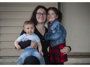 Maddie Cannon with her children Charlotte, 4 and Emma, 1, at their Surrey, BC home Saturday, May 14, 2022. Cannon has received support from the Options Community Services, a non-profit that has raised money to help vulnerable youth that aren't covered by government funding. (Photo by Jason Payne/ PNG)