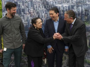 Squamish Nation Council President Khelsilem and Vancouver Mayor Kennedy Stewart announce details of the Senakw development, at a news conference at the Vancouver Museum on Wednesday, May 25, 2022. Pictured, From left to right, Vancouver Councilmember Michael Wiebe, Squamish Nation Councilmember and Spokesperson Syexwaliya (Ann Whonnock), Khelsilem, and Mayor Kennedy Stewart at the announcement.