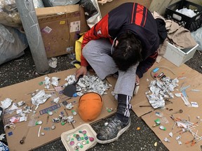 A drug user slumped in a downtown eastside lane in May 2022, a month when an average of 6.3 people died every day from toxic fentanyl in street drugs. British Columbia is on course for another record year in drug deaths. (NICK PROCAYLO/PNG)