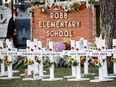 Crosses with the names of victims are pictured at a memorial outside Robb Elementary School after a gunman killed nineteen children and two teachers, in Uvalde, Texas.