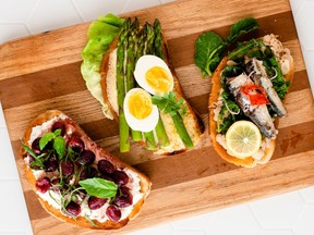 Toast gets an update: from left,  ricotta, roasted grapes and basil; asparagus with melted cheddar and egg; and greens, beans and sardines.