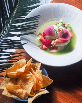 Cured prawns and scallops with avocado, strawberries, red onion, and jalapeno lime broth.