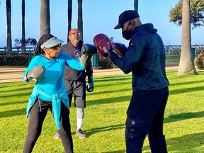 Santa Monicans of all ages find ways to exercise outdoors year-round, including boxing at Palisades Park.