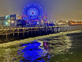 The Santa Monica Pier is always alive, especially at night when the roller coaster and Ferris wheel light up the sky.