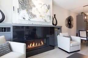 A modern fireplace is a focal point of the great room of a Duo Luxury Townhomes unit.