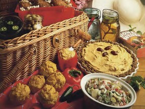 In a southern-style picnic basket are popcorn-packed Cajun drumsticks, jalapeño potato salad, and jars of Cajun martinis and iced tea.  Photo: Derik Murray.  For Kasey Wilson's column on July 7, 2022. [PNG Merlin Archive]