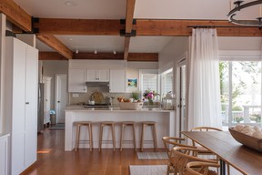 The kitchen layout stayed largely the same, but new countertops, cabinets and paint brightened everything up and tied in the coastal-modern palette.