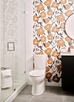 Whimsical wallpaper in the bathroom.