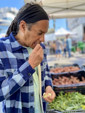 Celebrity chef Govind Armstrong samples cauliflower at the Wednesday morning farmers market in downtown Santa Monica.