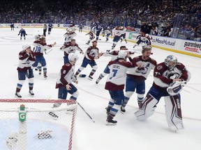 Colorado Avalanche players celebrate after defeating the Tampa Bay Lightning 2-1 in Game 6 of the 2022 NHL Stanley Cup Final at Amalie Arena on Sunday, June 26, 2022, in Tampa.
