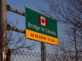 DETROIT, MI - FEBRUARY 08: A sign leading to the Ambassador bridge to Canada on February 8, 2022 in Detroit, Michigan. Due to Canadians protesting vaccine mandates, hundreds of trucks attempting to cross the Ambassador Bridge from Detroit to Windsor, Canada are now stuck on the US side after the bridge was closed.