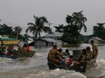 Bangladesh army personnel patrol the flooded areas to rescue and evacuate flood affected people following heavy monsoon rainfalls in Sunamgong on June 19, 2022.