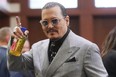 Johnny Depp appears in the courtroom during a break at the Fairfax County Circuit Courthouse in Fairfax, Va., Thursday, May 19, 2022.