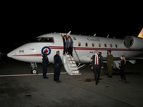 Michael Kovrig and Michael Spavor, accompanied by Canada's Ambassador to China, Domenic Barton, arrive after being released from detention in China, in Calgary, September 25, 2021.