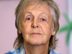 Sir Paul McCartney poses at the "Hey Grandude!" book signing at Waterstones Piccadilly on September 06, 2019 in London.