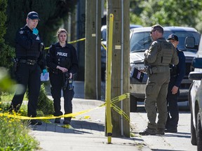 RCMP and IHIT members investigate at the scene of a homicide in the 2700-block Davies Avenue in Port Coquitlam,  Thursday, June 30, 2022.
