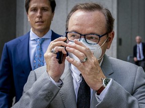 Actor Kevin Spacey appears to talk in his phone as he leaves court after testifying in a civil lawsuit, Thursday, May 26, 2022, in New York.