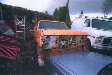 Old vehicles parked on the Picktons' Burns Road property. Robert Pickton trial evidence - photos from a package titled Exhibit #77 - Specific Photos.