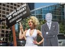 A drag queen dressed as Marilyn Monroe calls on US President Joe Biden to be a climate leader while singing 