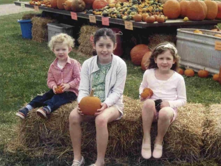 Sophie Cowin (centre) with her younger sister and brother when she was eight years old, shortly before she had her first epileptic seizure. Photo: Courtesy of Katherine Cowin