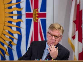 Commissioner Austin Cullen listens to presentations before opening statements at the Cullen Commission of Inquiry into Money Laundering in British Columbia, in Vancouver, February 24, 2020. The commission's final report is expected to be submitted to the government today.