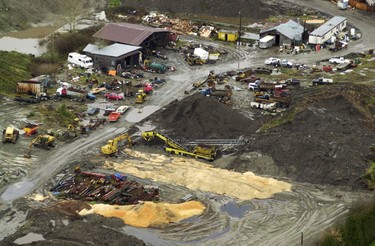 This grouping of vehicles, buildings and earth piles lies immediately to the north of the farm. The boundary lines are hard to discern. Coquitlam RCMP and members of the Missing Women task force searched this former pig farm on Dominion Road in Port Coquitlam.