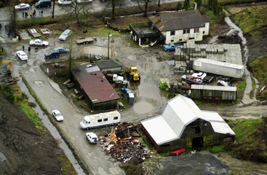 LOOKING BACK AT THE MISSING WOMEN INVESTIGATION: Coquitlam RCMP and members of the Missing Women task force search this former pig farm on Dominion Road in Port Coquitlam. At the time, Robert Pickton, listed as one of three owners of the property, was a person of interest in the ongoing investigation into the disappearance of 50 women. Dominion Rd. is at the top with the house, barn and other buildings surrounded by piles of earth. The Motorhome is the RCMP command centre.